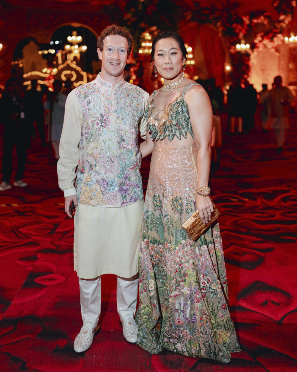 This photograph released by the Reliance group shows Mark Zuckerberg and his wife Priscilla Chan posing for a photograph at a pre-wedding bash of Mukesh Ambani's son Anant Ambani in Jamnagar, India, Saturday, Mar. 02, 2024. (Reliance group via AP)