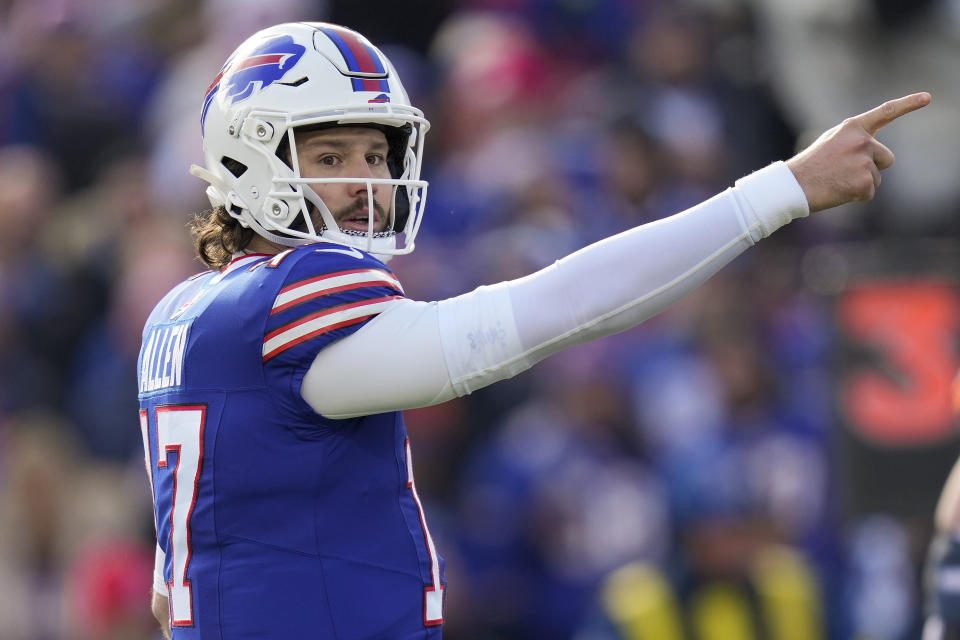 Buffalo Bills quarterback Josh Allen (17) motions for a first down during the first quarter of an NFL wild card playoff football game against the Denver Broncos, Sunday, Jan. 12, 2025, in Orchard Park, N.Y. (AP Photo/Seth Wenig)