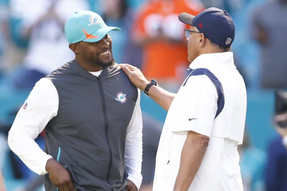 MIAMI GARDENS, FLORIDA - NOVEMBER 07: (L-R) Head coaches Brian Flores of the Miami Dolphins and David Culley of the Houston Texans talk during pregame at Hard Rock Stadium on November 07, 2021 in Miami Gardens, Florida. (Photo by Michael Reaves/Getty Images)