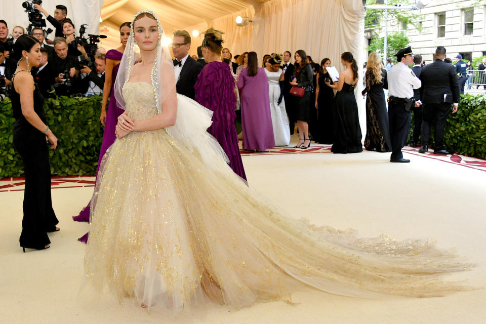 <p>Kate Bosworth took the Catholic theme to new heights, dressing up an ethereal bride in this Oscar de la Renta ivory gown and veil. Photo: Getty Images </p>