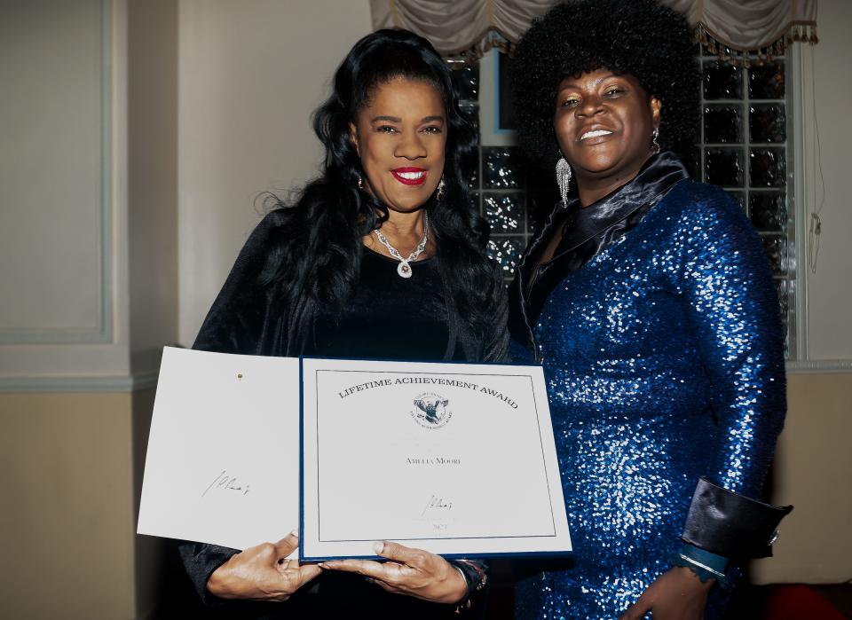 Amelia Moore, recipient of the President's Lifetime Achievement Award, shares the honor with Dr. Reba Renee Perry-Ufele of Diva Dynasty Magazine.