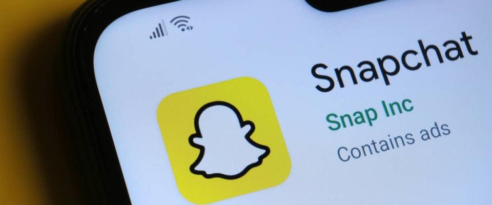 Snapchat app seen on the corner of mobile phone.