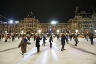 People enjoy skating on the ice rink opened on Red Square, with the GUM State Department store in the background in Moscow, Russia, Monday, Nov. 28, 2022. Moscow temperatures on Monday dropped to -5°C ( 23 F). (AP Photo)