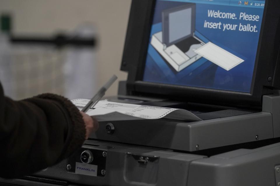 A voter casts their ballot on Election Day, at the Milwaukee County Sports Complex Tuesday, Nov. 3, 2020, in Franklin, Wis. (Morry Gash/AP)