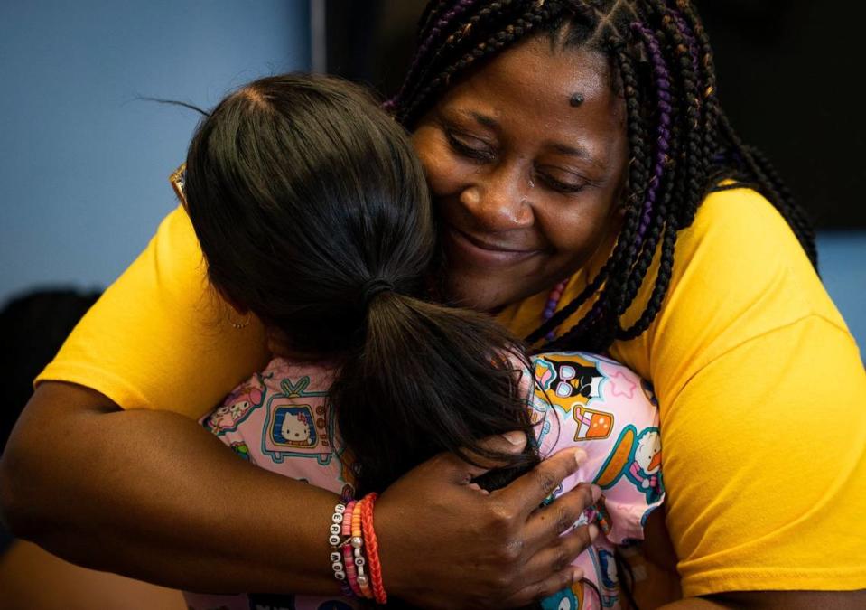 Dhima Martin, right, hugs Sara Duque, who was her daughter Symaria Glenn’s nurse after a press conference on Tuesday, April 9, 2024, at Memorial Regional Hospital’s Transplant Institute in Hollywood, Fla. Glenn’s were donated when she died to save five people, including her father Shawn who was waiting a kidney transplant.