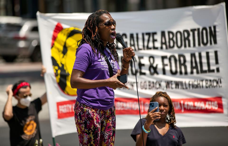 FILE - Mokah Jasmine Johnson, who is running for state House seat in District 120, speaks to the crowd during an abortions rights rally in response to the U.S. Supreme Court decision overturning Roe v. Wade on Saturday, June 25, 2022 in downtown Athens.