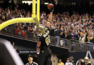 NEW ORLEANS, LA - NOVEMBER 28: Tight end Jimmy Graham #80 of the New Orleans Saints slams the ball over the goal post after his five-yard touchdown catch in the second quarter against the New York Giants at Mercedes-Benz Superdome on November 28, 2011 in New Orleans, Louisiana. (Photo by Ronald Martinez/Getty Images)