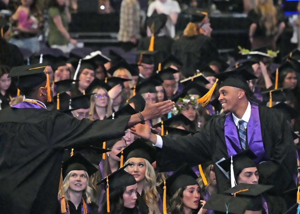 Graduates celebrate during Grand Canyon University's 2023 commencement ceremony on April 28.