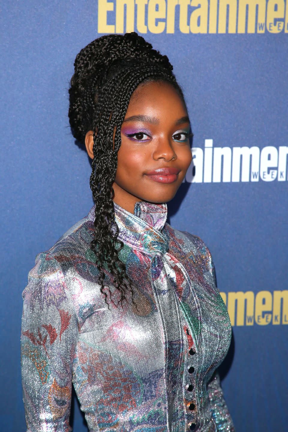 <p>Not into a basic bun? Create a deeply parted bang to elegantly frame the face like actress Marsai Martin.</p>