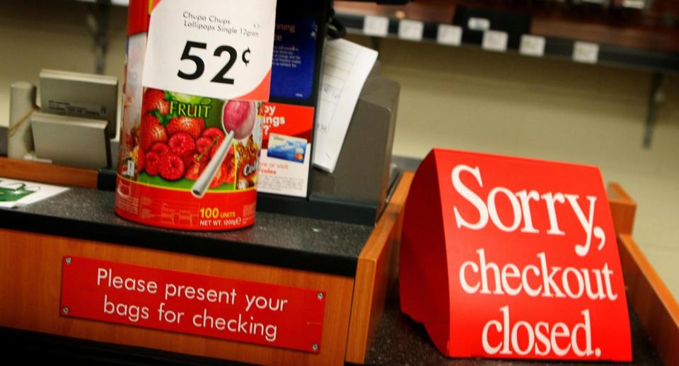 A supermarket register with the sign 