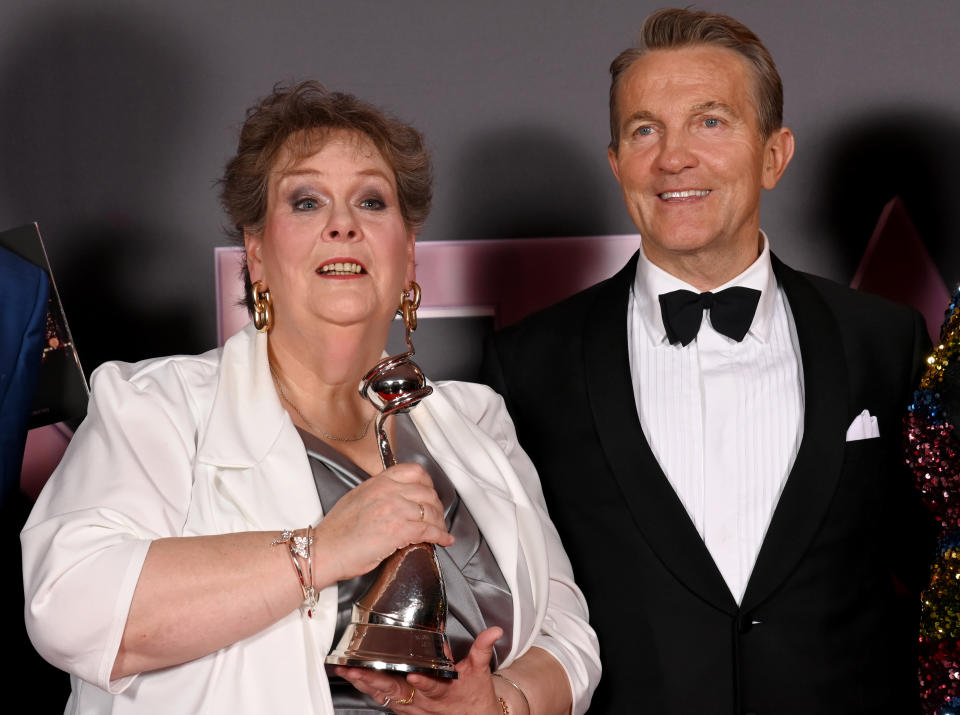 LONDON, ENGLAND - OCTOBER 13: Anne Hegerty and Bradley Walsh with the Quiz Game Show award for 'Beat the Chasers' in the winners' room at the National Television Awards 2022 at OVO Arena Wembley on October 13, 2022 in London, England. (Photo by Dave J Hogan/Getty Images)