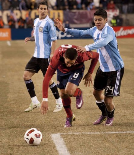 Marcos Rojo (24) of Argentina and Clint Dempsey (8) of the USA during the friendly match between the USA and Argentina at Giants Stadium in East Rutherford, NJ. The game ended in a 1-1 tie