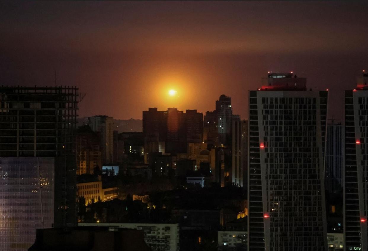 An explosion is seen in the sky over Kyiv during a Russian drone and missile strike, amid its overnight attack on Ukraine (Reuters)