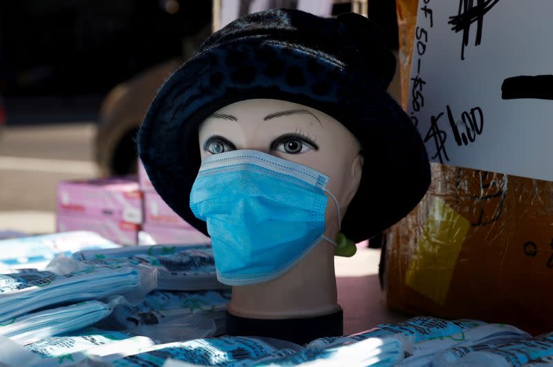 FILE PHOTO: Mannequin is seen displayed with surgical mask on a street corner during outbreak of coronavirus disease (COVID-19) in New York