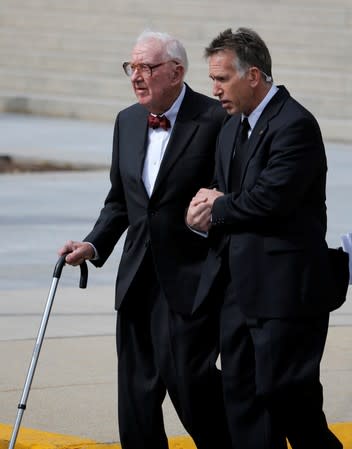 FILE PHOTO: Retired U.S. Supreme Court Justice John Paul Stevens departs the funeral of U.S. Supreme Court Associate Justice Antonin Scalia at the Basilica of the National Shrine of the Immaculate Conception in Washington
