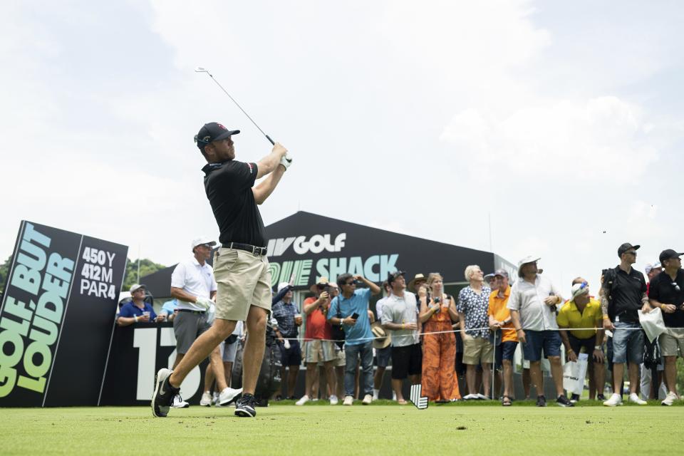 Talor Gooch of RangeGoats GC hits his shot from the 13th hole during the first round of LIV Golf Singapore at the Sentosa Golf Club on Friday, April 28, 2023 in Sentosa, Singapore. (Charles Laberge/LIV Golf via AP)