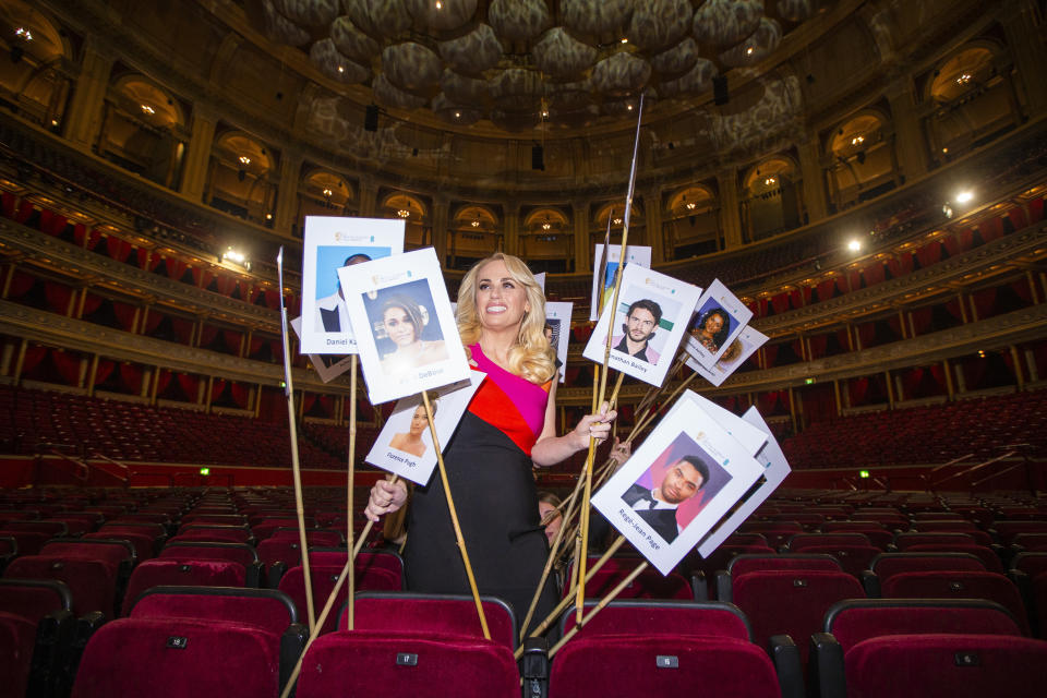 Rebel Wilson poses for photographers amongst the seating plan ahead of the British Academy Film Awards on that take place on Sunday, Mar. 13, at the Royal Albert Hall in central London, Tuesday, Mar. 8, 2022. (Photo by Joel C Ryan/Invision/AP)