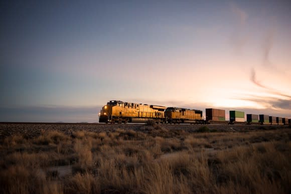 A train pulling cargo across the plains.