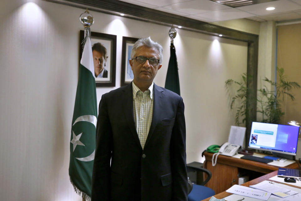 Pakistan's top health official Faisal Sultan poses for photograph at his office in Islamabad, Pakistan, Monday, May 24, 2021. Sultan who is overseeing the country's response to coronavirus said Monday the new COVID-19 variant that devastated neighboring India by causing record infections and deaths had not been found in Pakistan yet. (AP Photo/Anjum Naveed)