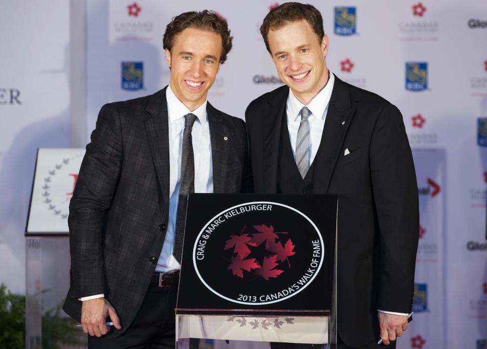 Social advocates Craig and Marc Kielburger pose beside their star during Canada's Walk of Fame induction ceremonies in Toronto