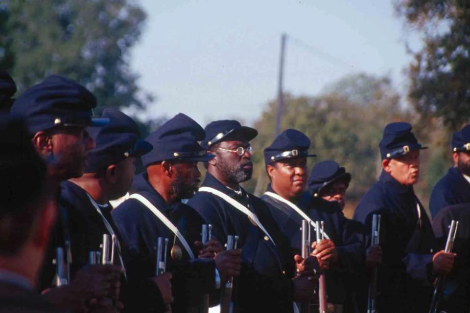 Reenactors portray soldiers with the First Kansas Colored Volunteer Infantry Regiment, who played a key role in the Battle of Honey Springs. Fought on July 17, 1863, the Battle of Honey Springs was the largest of about 107 documented Civil War military engagements in present-day Oklahoma. A reenactment takes place biennially at the Honey Springs Battlefield and Visitors Center near Checotah.