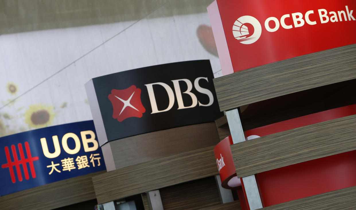 United Overseas Bank (UOB), DBS and Oversea-Chinese Banking Corp (OCBC) automated teller machines are pictured at the airport in Singapore April 30, 2014. Singapore's DBS Group Holdings and OCBC reported record first-quarter profit that topped market forecasts, powered by double-digit loan growth and improved margins. The results also showed the banks' asset quality has not been affected by deteriorating bad debt problems in China and came despite slower growth in Singapore's housing market.
  REUTERS/Edgar Su (SINGAPORE - Tags: BUSINESS)