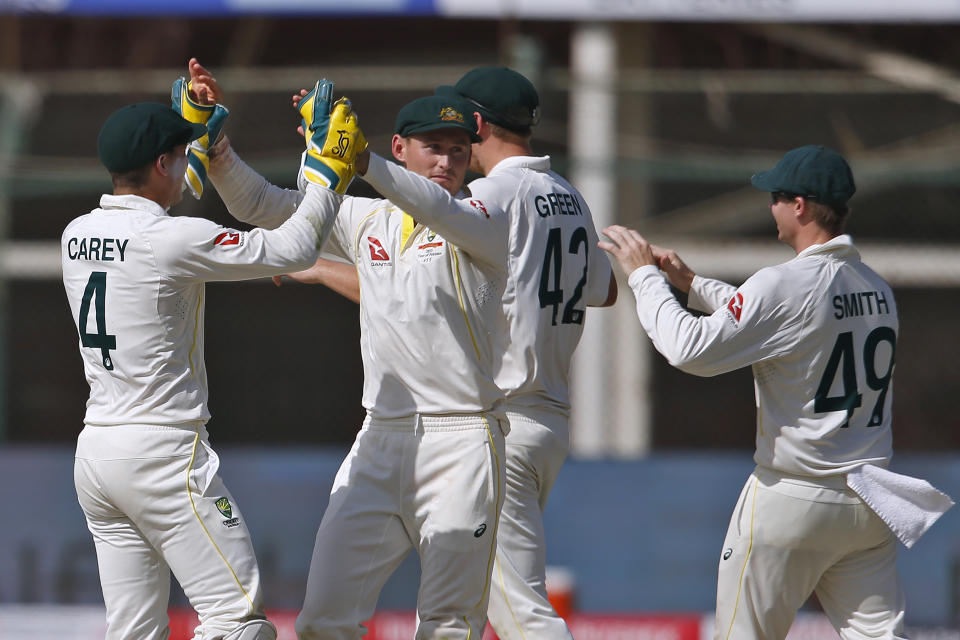 Australia's Marnus Labuschagne, center, celebrates with teammates after dismissal of Pakistan Hasan Ali on the third day of the second test match between Pakistan and Australia at the National Stadium in Karachi, Pakistan, Monday, March 14, 2022. (AP Photo/Anjum Naveed)