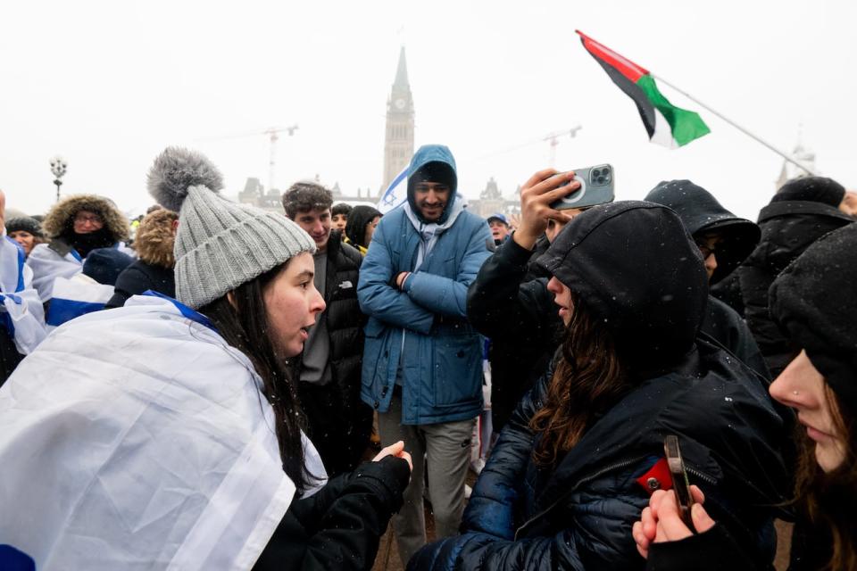 Pro-Israel protesters, left, argue with pro-Palestinian protesters during a pro-Israel protest near Parliament Hill in Ottawa on Monday, Dec. 4, 2023. The conflict in the Middle East has proven divisive both for Canadians and the Liberal Party. 