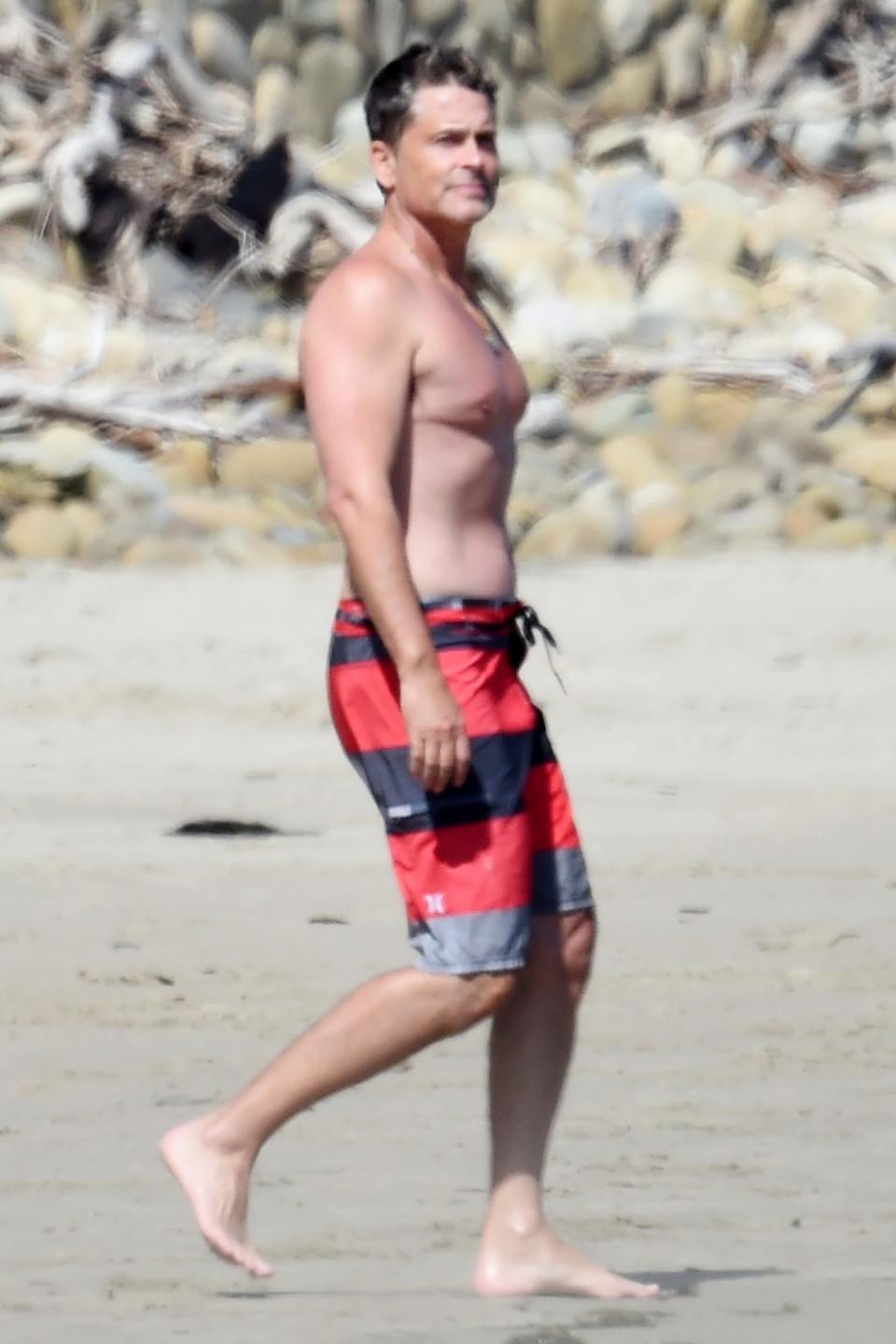 <p>Rob Lowe enjoys a beach day with his son Matthew in Santa Barbara on Saturday.</p>