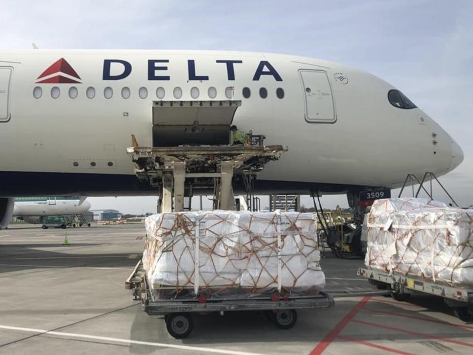 Delta cargo being loaded into an aircraft.