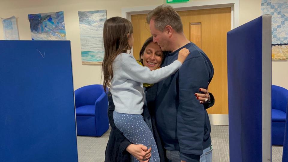 Nazanin, Gabriella and Richard embrace as she arrived back in the UK (Tulip Sadiq)