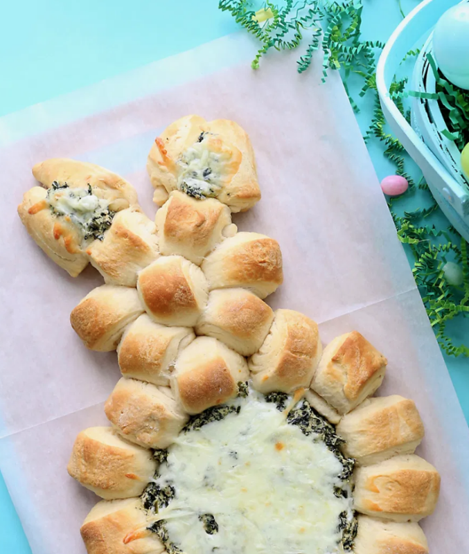 <p>It's Always Autumn</p><p>This is one fun Easter appetizer! Hot, melty, cheesy spinach dip is surrounded by crescent roll bites that are perfect for scooping up the dip.</p><p><strong>Get the recipe: <a href="https://www.itsalwaysautumn.com/easter-bunny-spinach-dip-easy-easter-appetizer.html" rel="nofollow noopener" target="_blank" data-ylk="slk:Easter Bunny Spinach Dip;elm:context_link;itc:0;sec:content-canvas" class="link ">Easter Bunny Spinach Dip</a></strong></p>