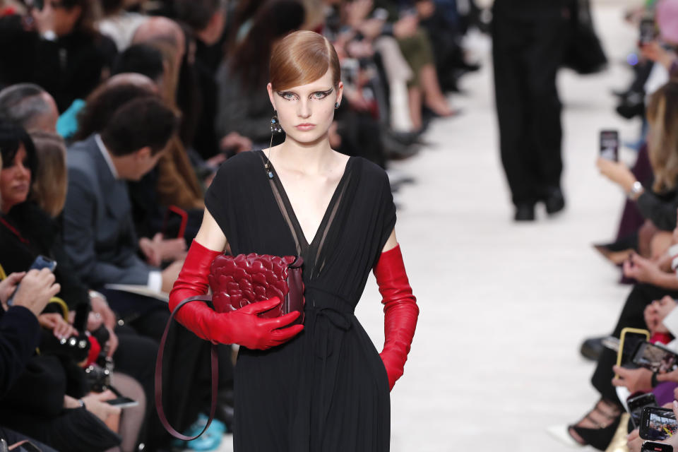 A model wears a creation for the Valentino fashion collection during Women's fashion week Fall/Winter 2020/21 presented in Paris, Sunday, March 1, 2020. (AP Photo/Francois Mori)