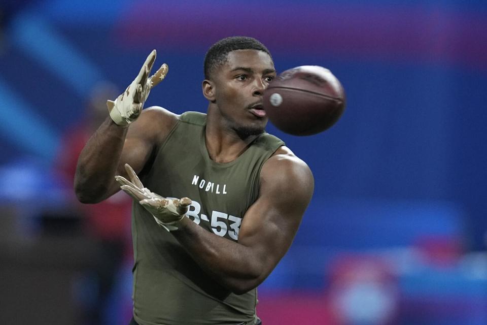 Miami defensive back Kamren Kinchens performs a drill at the NFL scouting combine on Friday.