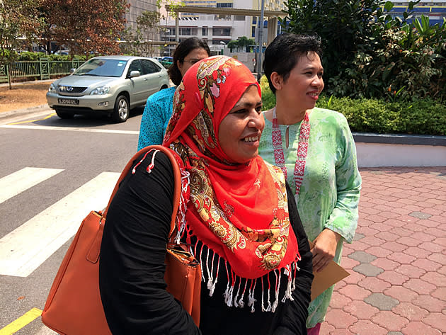 Sharifah bte Shafie, mother of Nurul Rohana Binte Ishak, leaves the Subordinate Courts after learning that Singapore has withdrawn its trespass charges against her daughter. (Yahoo photo)