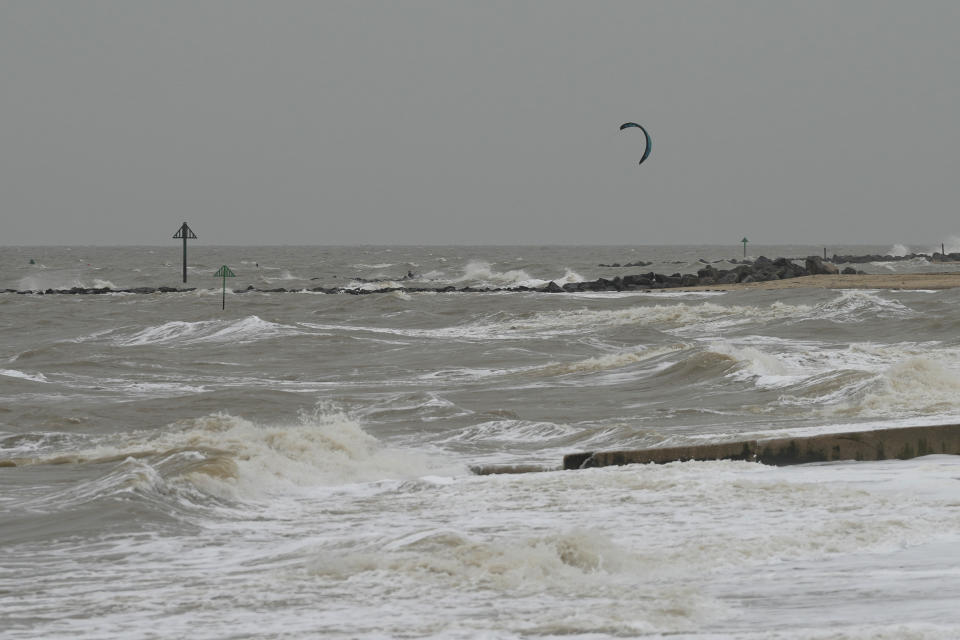 Wind surfers on the sea as they take advantage of strong winds near Clacton-on-Sea, England, Wednesday, Oct. 18, 2023. Storm Babet is due to cross the United Kingdom with yellow wind warnings from Wednesday to Saturday in place, an red rain warning has also been issued for parts of Scotland. (AP Photo/Frank Augstein)