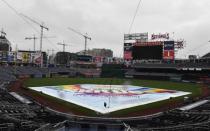 May 16, 2018; Washington, DC, USA; The tarp covers the field at Nationals Park. The games between the New York Yankees and Washington Nationals have been postponed until June 18, 2018. Mandatory Credit: Brad Mills-USA TODAY Sports