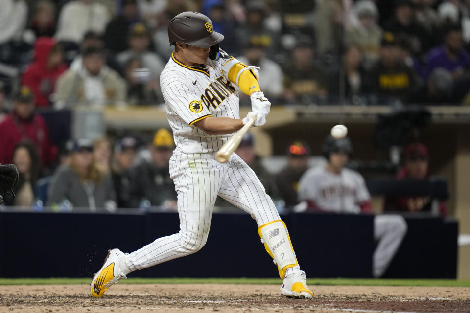 San Diego Padres' Ha-Seong Kim hits a walk-off home run during the ninth inning of a baseball game against the Arizona Diamondbacks, Monday, April 3, 2023, in San Diego. (AP Photo/Gregory Bull)