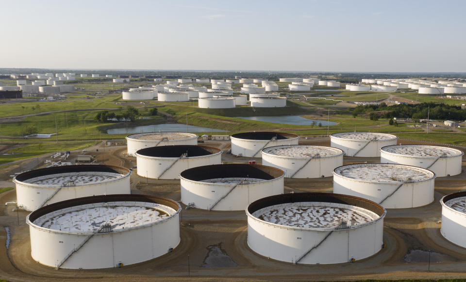 An aerial view of a crude oil storage facility is seen on May 4, 2020 in Cushing, Oklahoma. - Using his fleet of drones, Dale Parrish tracks one of the most sensitive data points in the oil world: the amount of crude stored in giant steel tanks in Cushing, Oklahoma. The West Texas Intermediate oil stored in the small town in the midwestern United States is used as a reference price for crude bought and sold by refiners in Asia, hedge funds in London and traders in New York. (Photo by Johannes EISELE / AFP) (Photo by JOHANNES EISELE/AFP via Getty Images)