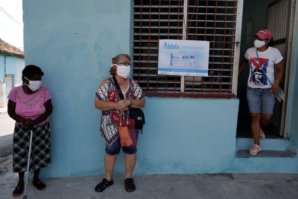 Image: People wait in line to enter a vaccination center in Havana on May 12, 2021. (Alexandre Meneghini / Reuters)