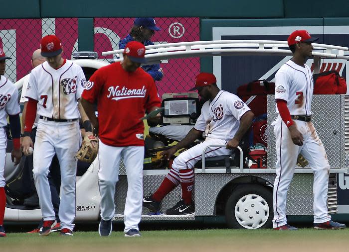 Washington Nationals outfielder Howie Kendrick is carted off the field after suffering a strange and potentially serious leg injury. (AP)