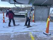 Skiers and snowboarders get on a chairlift at Gunstock Mountain Resort on Thursday, Dec. 21, 2023, in in Gilford, N.H. For most Americans dreaming of a white Christmas, this year's prospects aren't good. Although parts of the Rockies and Midwest already have snow or could get a fresh dusting by Monday, other parts of the country that are normally coated in white this time of year are still sporting their drab late-fall look. (AP Photo/Nick Perry)