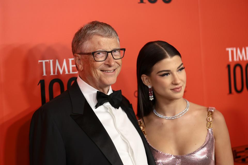 Bill Gates and Phoebe Gates in formal attire standing next to each other and posing for a photo.