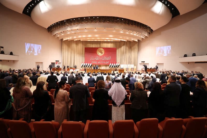 Iraqi lawmakers attend the first session of the new Iraqi parliament in Baghdad