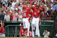 Washington Nationals' Kyle Schwarber, left, celebrates his three-run home run with Starlin Castro (13) during the fourth inning of the second baseball game of the team's doubleheader against the New York Mets, Saturday, June 19, 2021, in Washington. (AP Photo/Nick Wass)