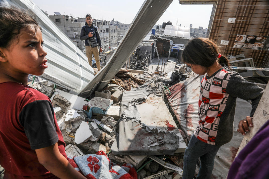 RAFAH, GAZA - APRIL 16: Children are seen among the rubble of destroyed building following an Israeli strike hit the house belonging to a displaced family in Rafah, Gaza on April 16, 2024. Many buildings were destroyed or heavily damaged in the attack. (Photo by Abed Rahim Khatib/Anadolu via Getty Images)