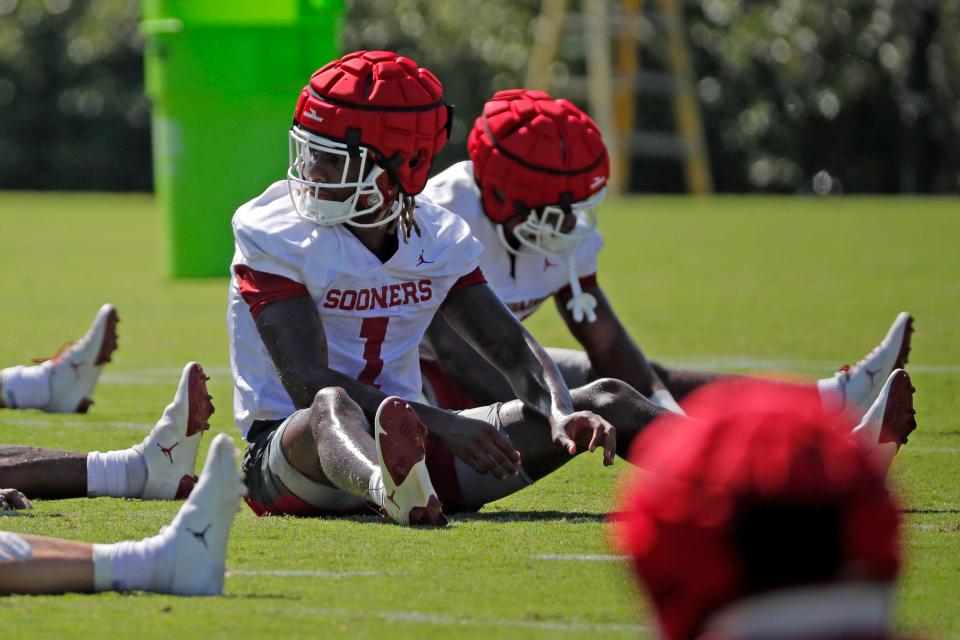 Oklahoma's Dasan McCullough stretches during a practice for the University of Oklahoma Sooners (OU) football team in Norman, Okla., Friday, Aug. 4, 2023.