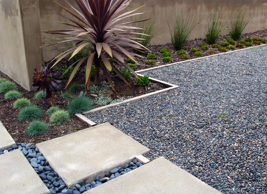 <body><p>Pea gravel has long been favored for its smooth texture and wonderful, natural color variation. At $35 – $55 a ton, it’s an affordable and attractive choice for almost any application: side yards, <a rel="nofollow noopener" href=" http://www.bobvila.com/gravel-driveway/31677-10-popular-driveway-options-to-welcome-you-home/slideshows#.VD2Fx_ldWSo?bv=yahoo" target="_blank" data-ylk="slk:driveways;elm:context_link;itc:0;sec:content-canvas" class="link ">driveways</a>, patios, walkways, and planting beds. And it can be mixed and matched with other landscaping features to add visual interest to any outdoor space.</p></body>