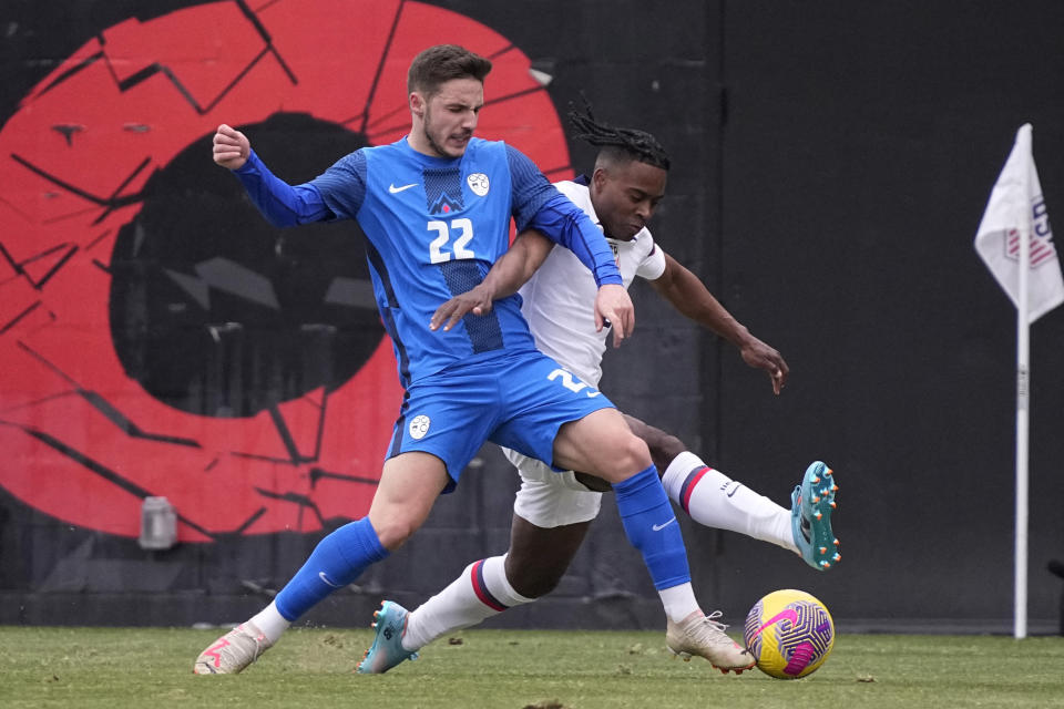 Slovenia midfielder Tamar Svetlin (22) and United States defender DeJuan Jones (5) battle for the ball during the first half of an international friendly soccer match in San Antonio, Saturday, Jan. 20, 2024. (AP Photo/Eric Gay)