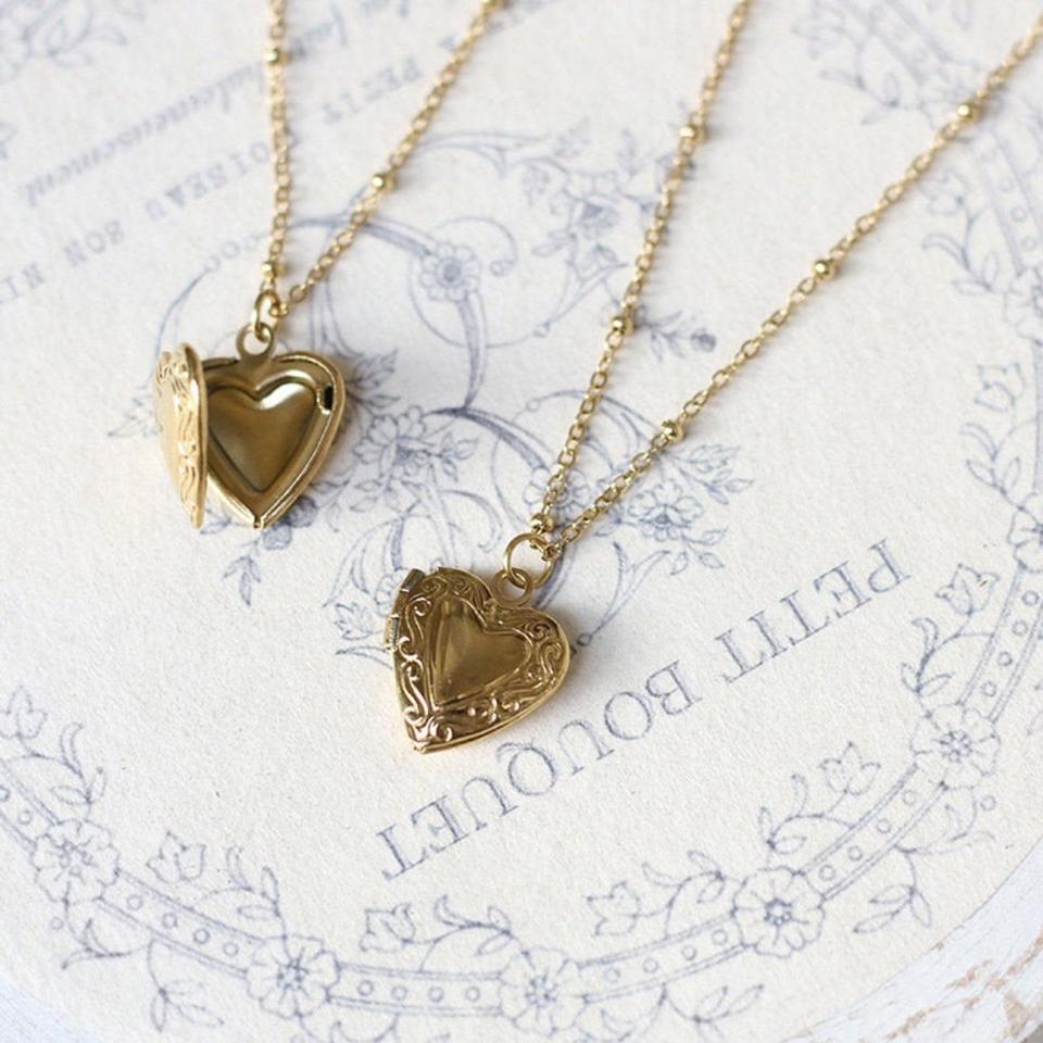 <h2><a href="https://fave.co/3dK0bLk" rel="nofollow noopener" target="_blank" data-ylk="slk:Personalized 18k Gold Plated Mini Heart Locket" class="link ">Personalized 18k Gold Plated Mini Heart Locket</a></h2><br>Lockets are the most classic displays of affection for a loved one and make for a wonderful personal gift. This retailer will even place a photo inside for you.<br><br><strong>ElmJewelryStudio</strong> Personalized 18k Gold Plated Mini Heart Locket Necklace, $, available at <a href="https://go.skimresources.com/?id=30283X879131&url=https%3A%2F%2Ffave.co%2F31w7y49" rel="nofollow noopener" target="_blank" data-ylk="slk:Etsy" class="link ">Etsy</a>